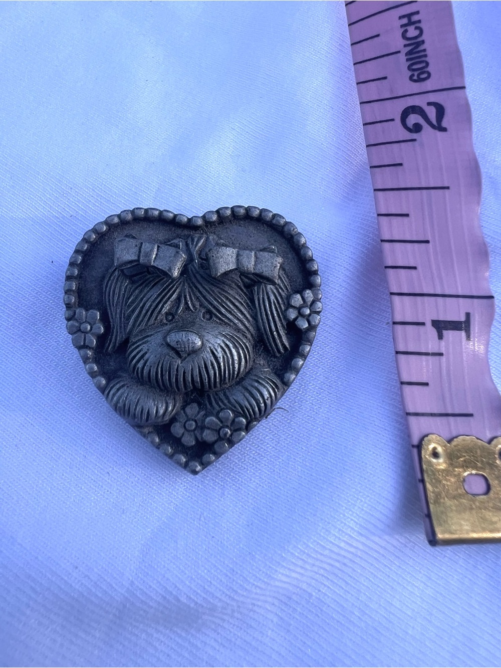 This is a vintage MS Dee puppy dog pewter brooch in a heart shape.